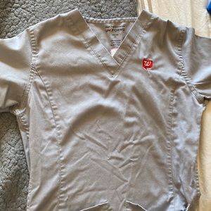 two womens walgreens pharmacy work shirts